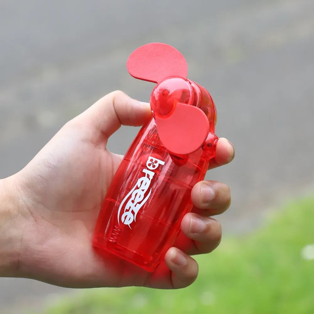 Breeze Hand Held Mini Fan Assorted Colours Pack of 12 DF1010 | Fan with Soft EVA Blades | Ideal for Travel and Outdoor Use | Keep Cool on the Go | 2 x AA Batteries Included
