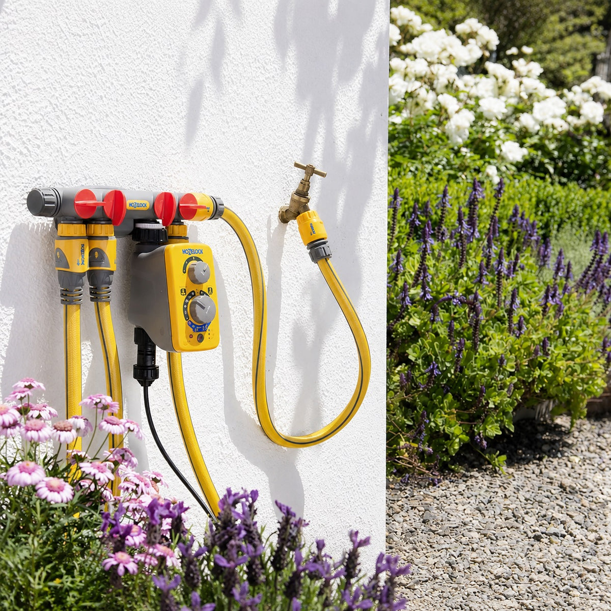 Hozelock Four-Way Tap Connector Multicoloured 2150P0000 | Outdoor Tap Hose Connector | Multi Outlet Tap Adapter | Garden Hose Pipe Distributor | Supplied With Complete Fittings